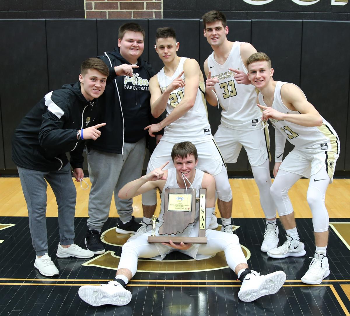 Members of the Penn Boys Basketball Team celebrate the 2019 Sectional Championship.