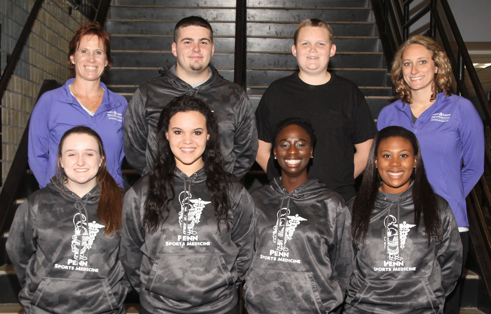 Penn High School student athletic trainers with certified trainers Tricia Irvin and Bailee Westra.