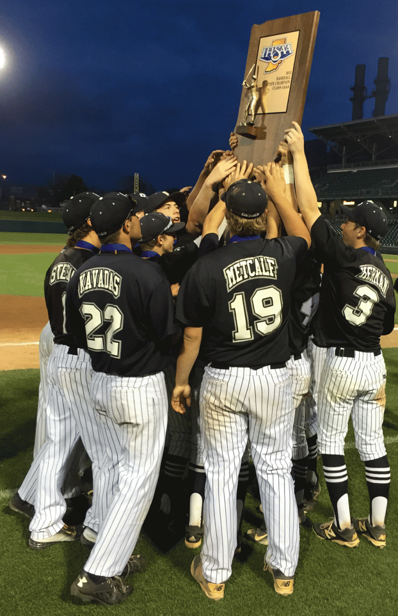 Penn Baseball players hoist the state championship trophy.