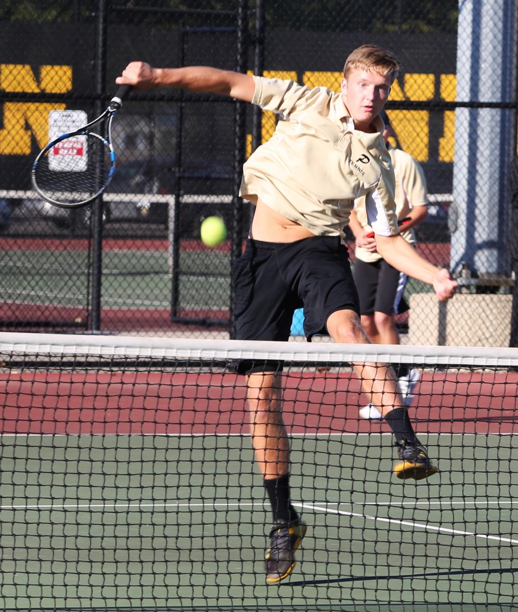 Eric Spaargaren returns a shot at the net.