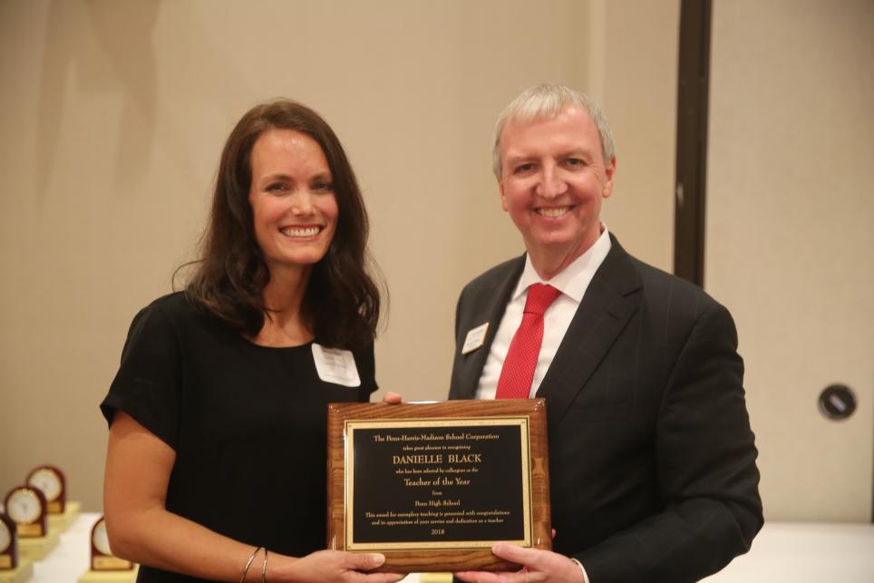 Danielle Black receiving her plaque from Supt. Dr. Thacker