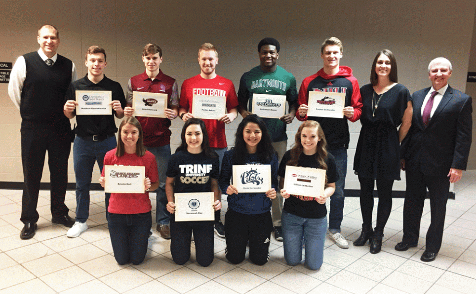Nine Penn student-athletes pose for a photo on National Signing Day.