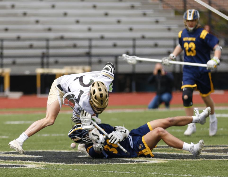 Avery Rivard wins a face-off.