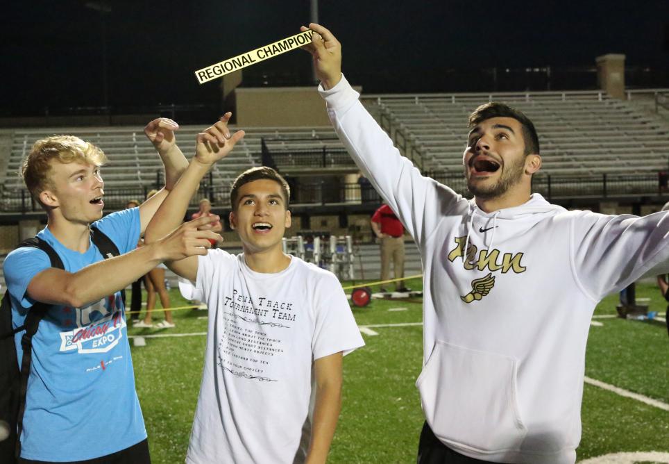 Regional Champions, from left, Kevin Krutsch, Mariano Retzloff and Caden Paquette celebrate Penn's Team Regional Championship.
