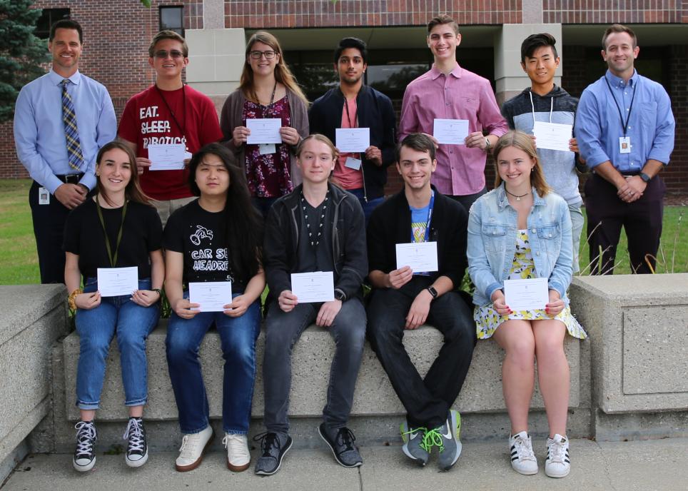 Penn High School Principal Sean Galiher, Director of Counseling John Westra, and Penn's National Merit Scholarship Commended Scholars.