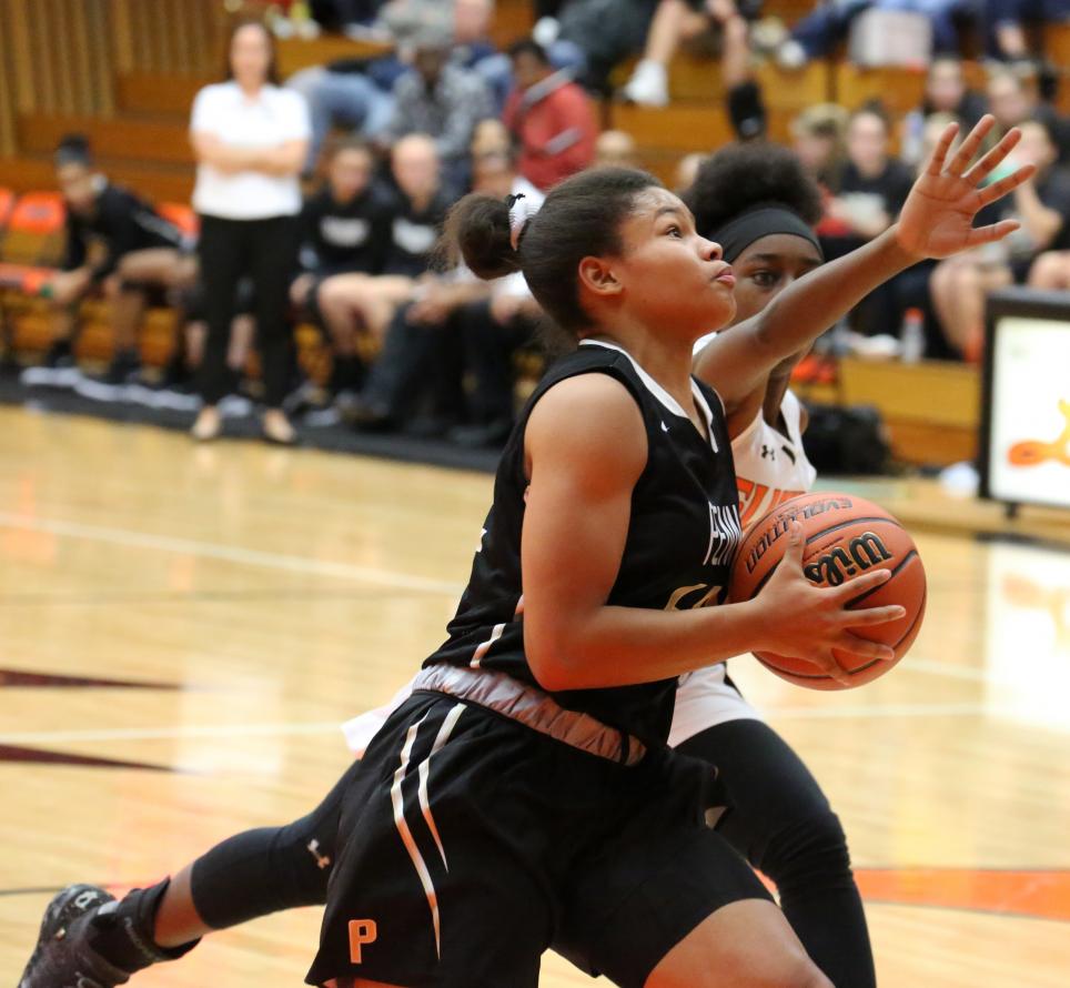 Penn's Trinity Clinton drives to the hoop.