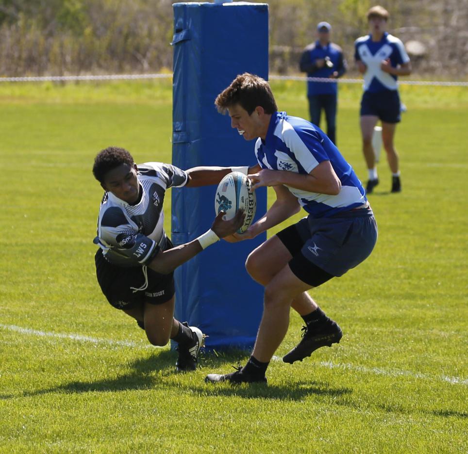 Alec Hardrict dives to steal the ball for a score.