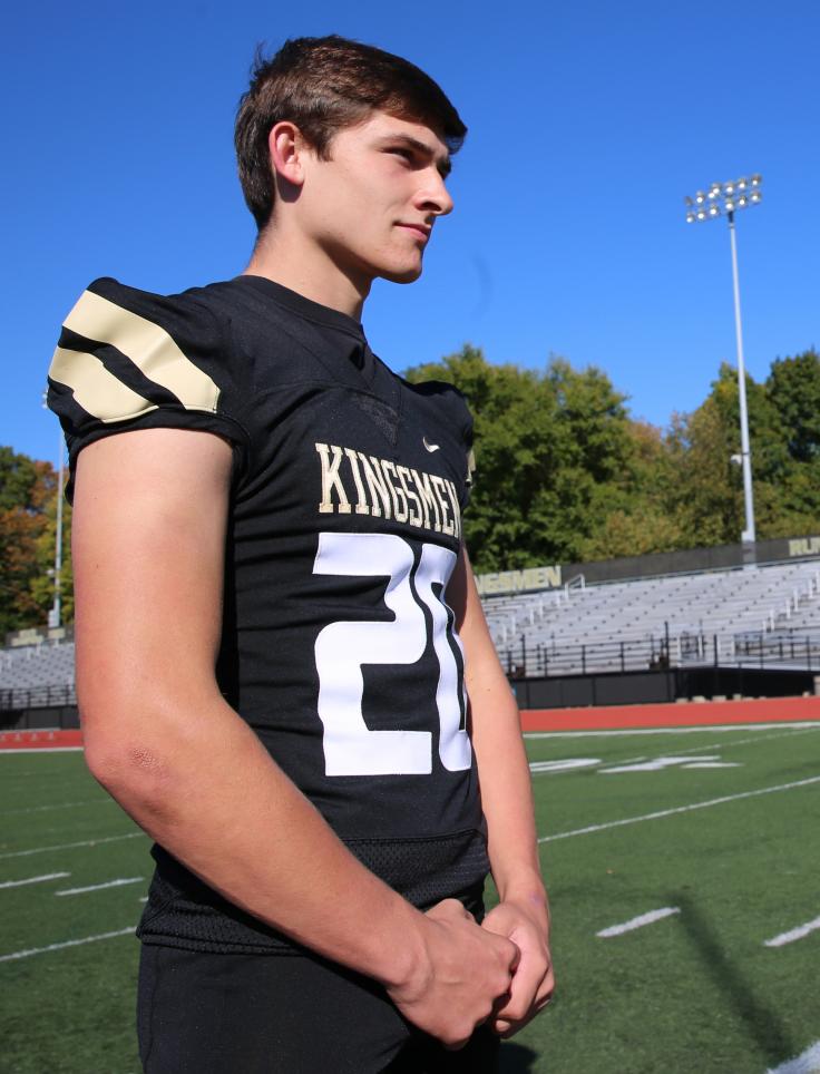 Penn Football Player Zack Messer models one of Penn's new football uniforms.
