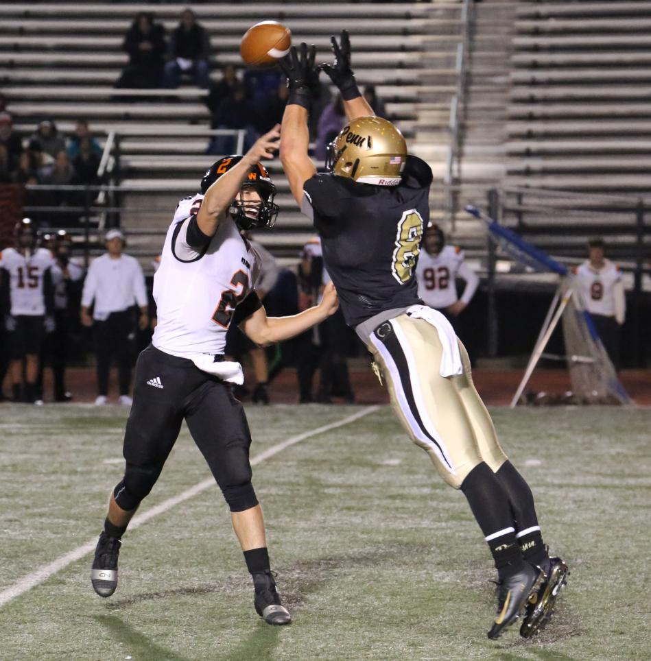 Penn linebacker Caden Paquette pressures Warsaw's quarterback.