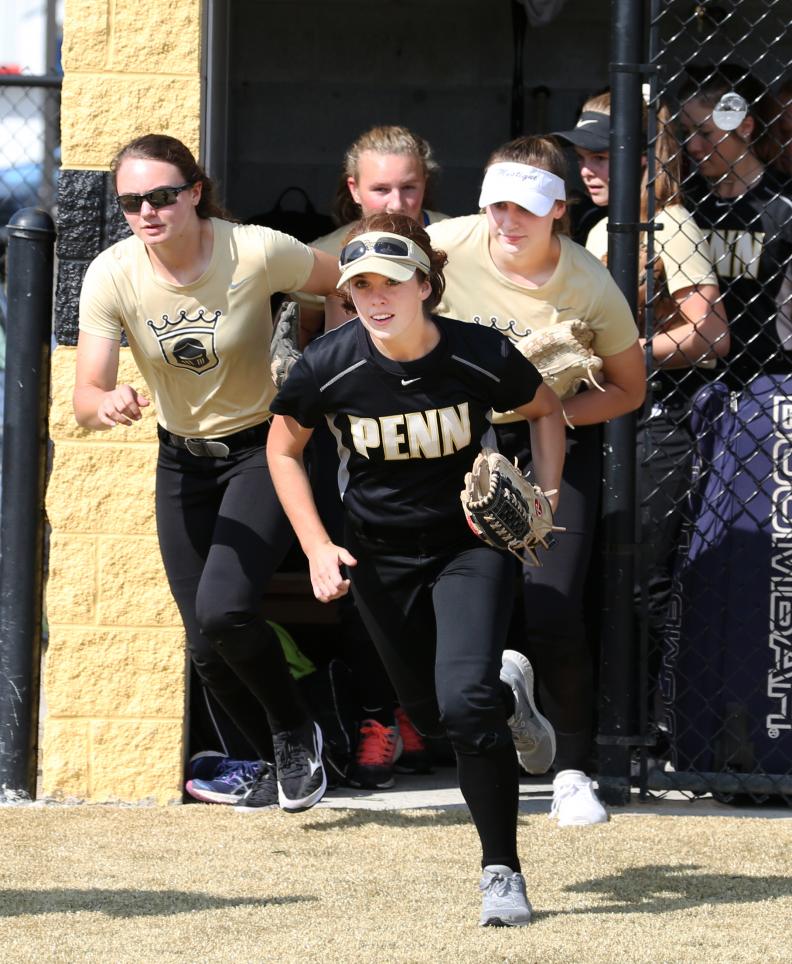The Penn Kingsmen Softball Team sprints onto its new turf field.