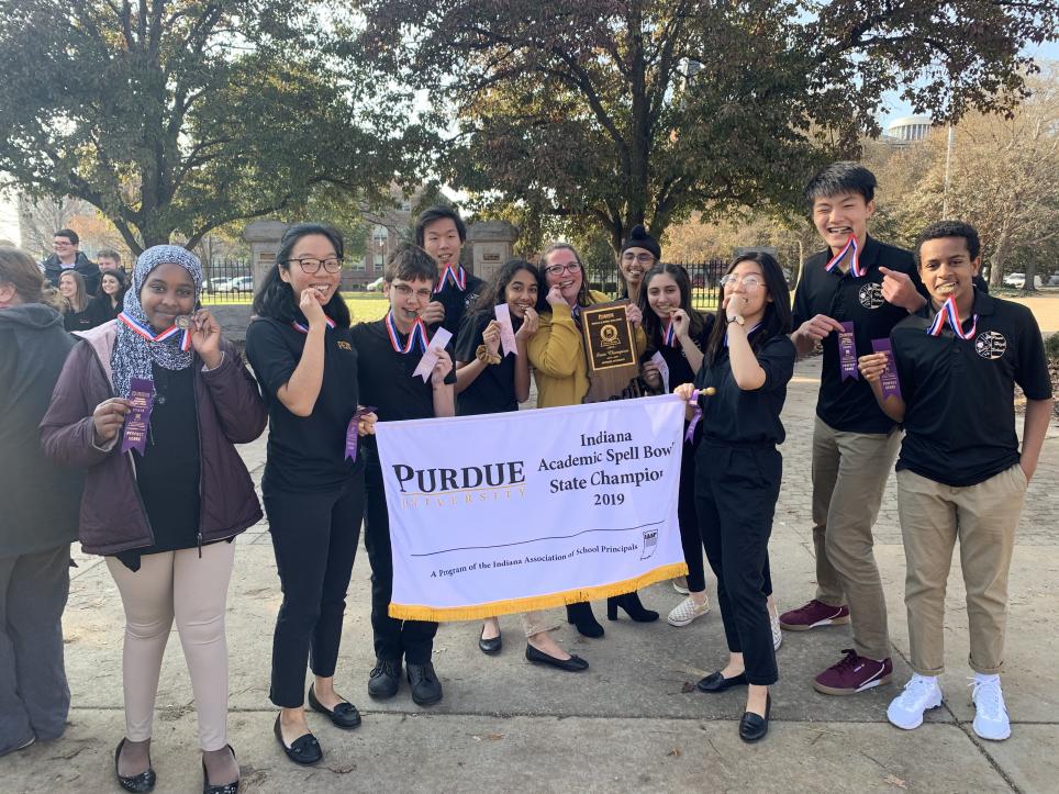 Penn Spell Bowl with the State Championship banner.