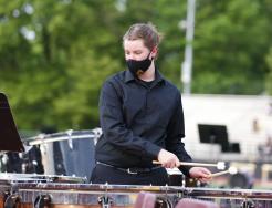A percussionist for the Penn Band performs at Concert on the Track.