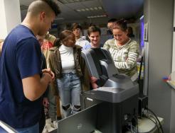 Penn students look at microscope