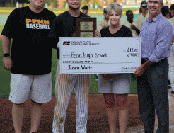 Trevor Waite, accompanied by his parents, accepts the IHSAA Mental Attitude Award from an IHSAA representative.