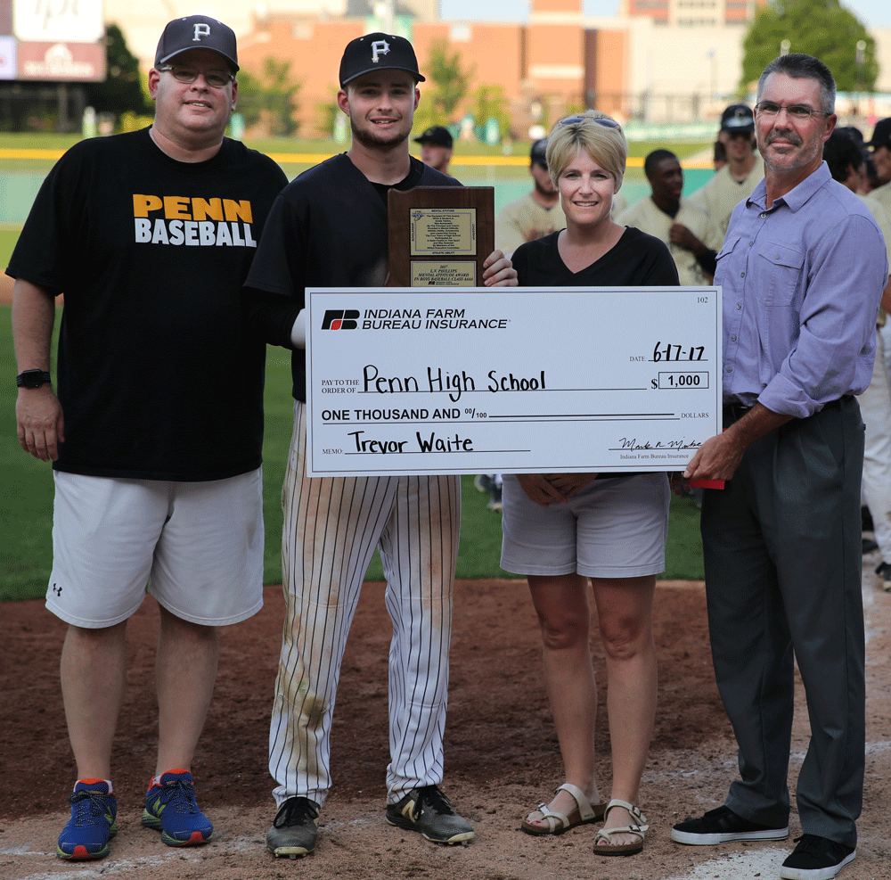 Penn Baseball Player Trevor Waite, accompanied by his parents, accepts the IHSAA Mental Attitude Award from an IHSAA representative.