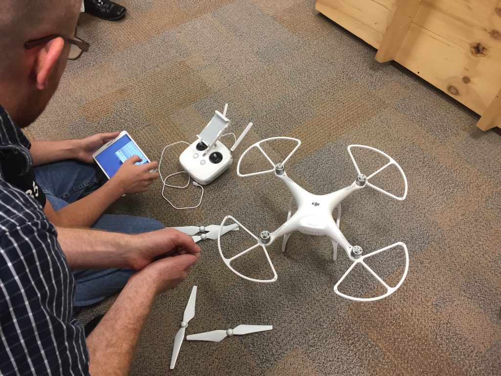 Penn teacher Evan White oversees assembly of the drone.