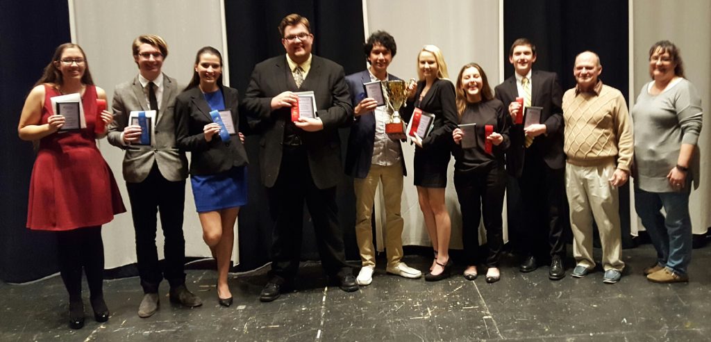 Penn's eight qualifiers for the Debate Nationals with head coach David Dutton and assistant coach Dawn Troyer.