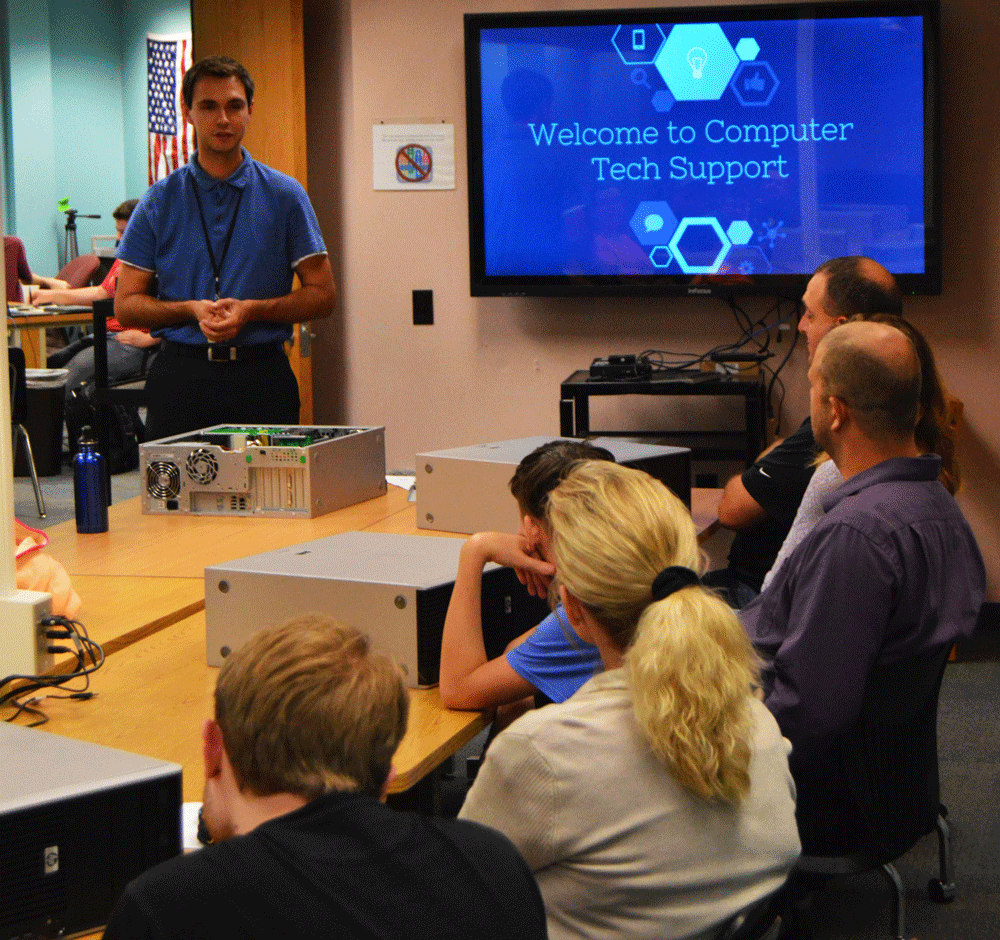 Penn Instructor Steve Sinish talks to parents about the Computer Tech Support class.