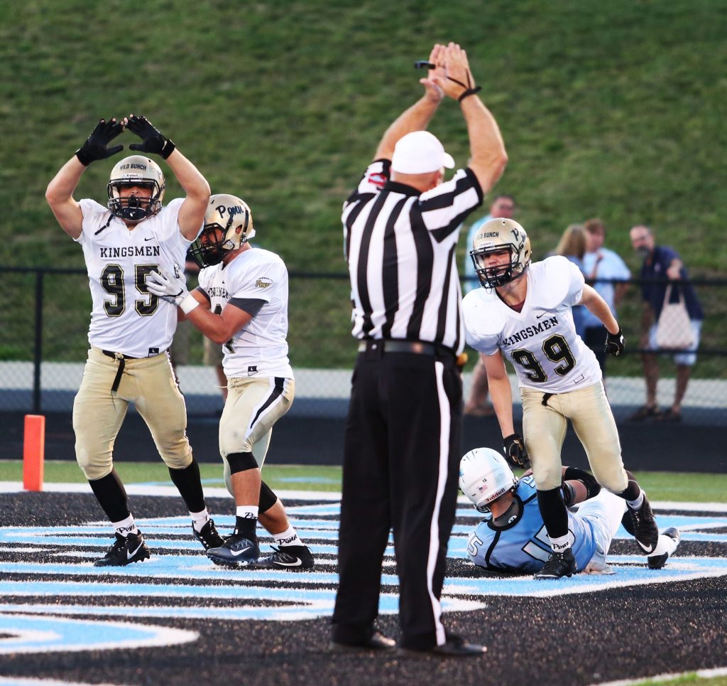 James Morris and the referee signal safety for the Kingsmen after Mason sacked the St. Joseph quarterback.
