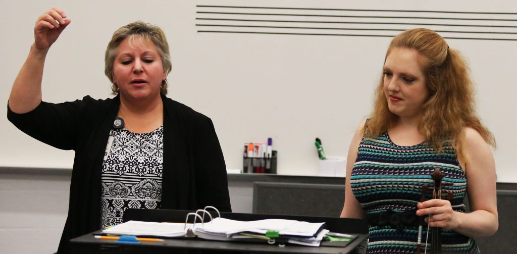 Anne Tschetter, left, and Rachel Barton Pine instruct the Penn Symphonic Orchestra.