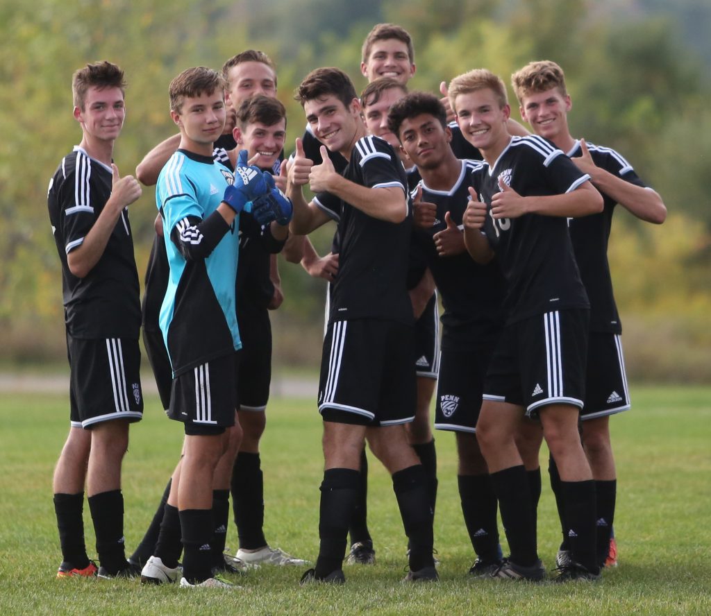 The 2017 Penn Boys Soccer Team huddles up before a game at Bremen.