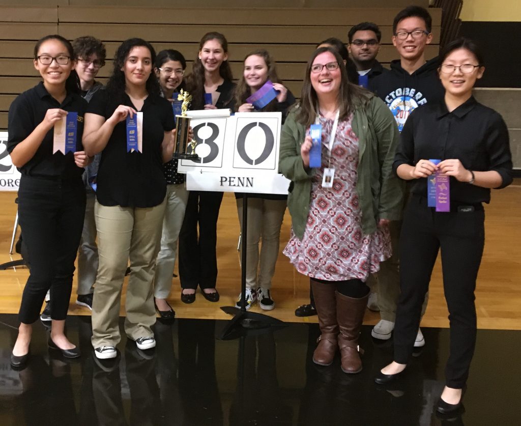 The Penn Spell Bowl Team poses with Blue Ribbons after winning the Kouts Invitational.