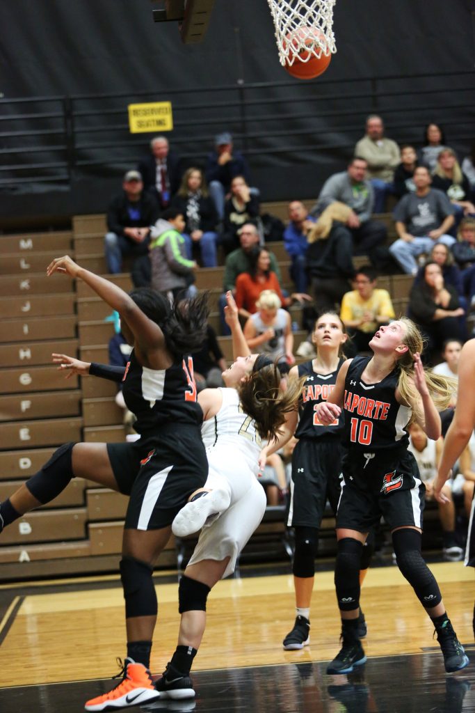 Sara Doi connects for a basket despite contact.