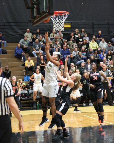 Tia Chambers powers inside for a basket.