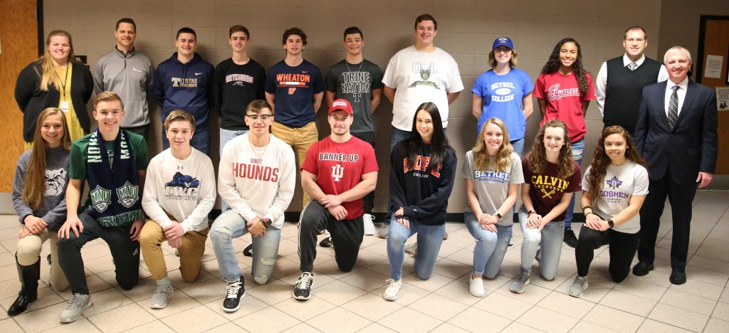 P-H-M Supt. Dr. Jerry Thacker, Principal Sean Galiher, Athletic Director Aaron Leniski, Assistant Athletic Director Marie Doan, and the Kingsmen student-athletes who signed to continue their athletic careers at the collegiate level.