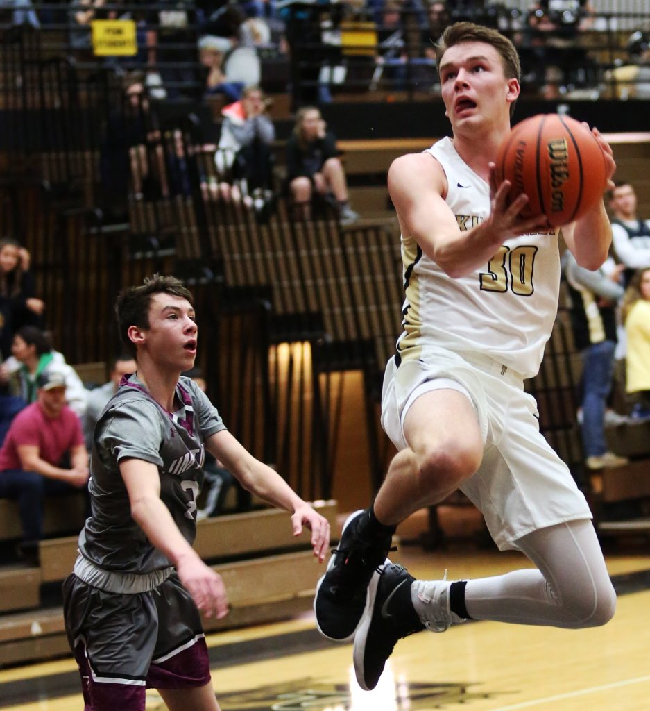 Noah Applegate launches for a basket.