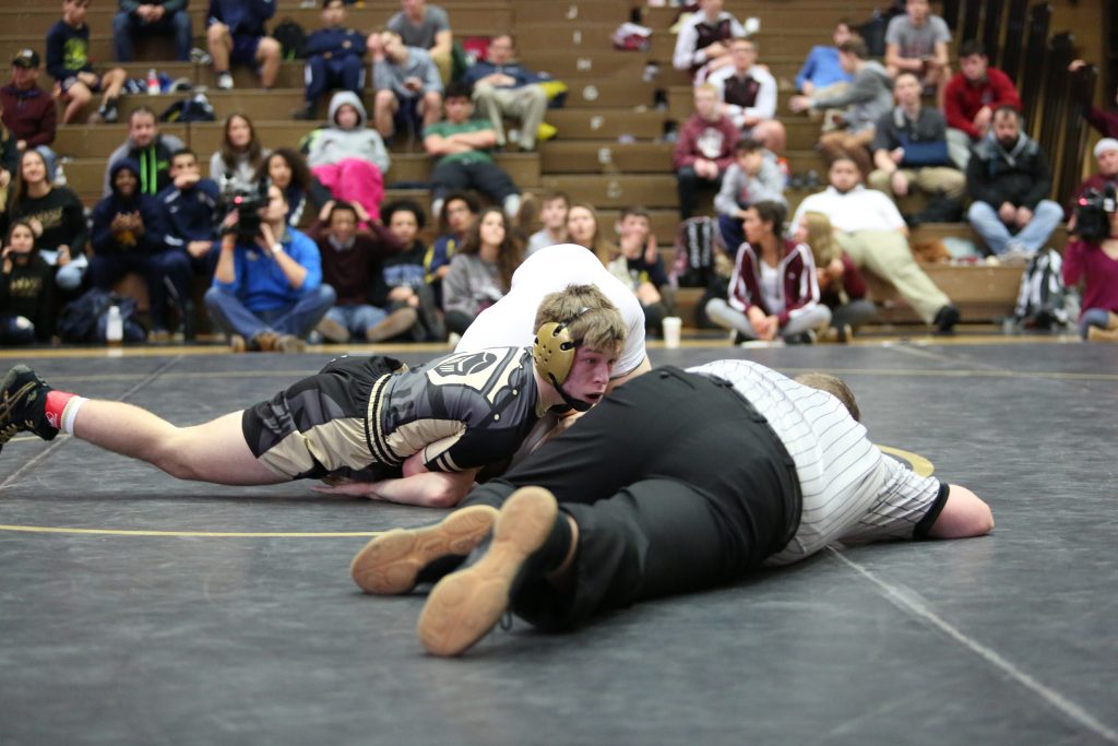 Tanner DeMien looks for the pin.