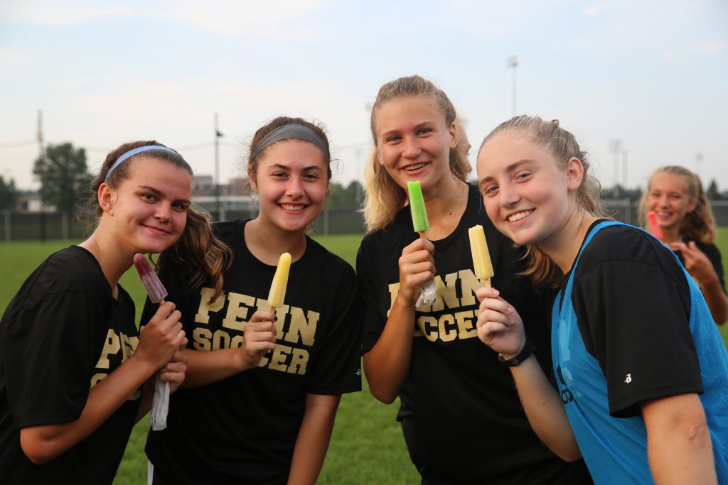 Girls soccer players enjoy their popsicles