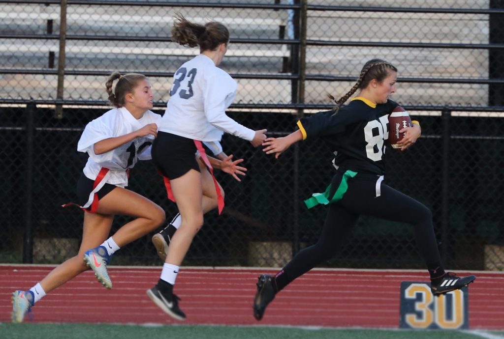 Cassie Norris sprints to the end zone on her way to a touchdown.