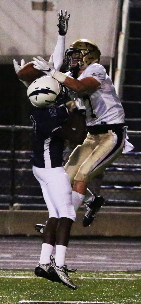 Penn's Brock Boynton makes a catch off the helmet of an Elkhart Central player.