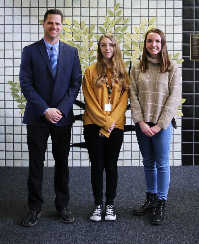 Penn High School Principal Sean Galiher and Silver Medal Award Winners in the National Scholastic Art competition, from left, Melina Tzanetatos and Camryn Murphy.