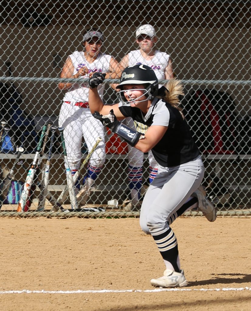 Ryleigh Langwell celebrates as she heads toward home plate after hitting a home run.