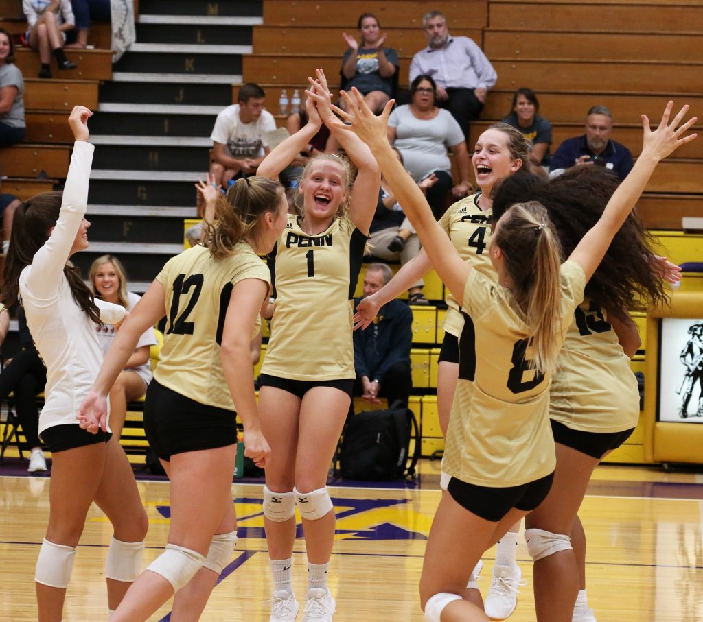 Penn Volleyball players celebrate a point.