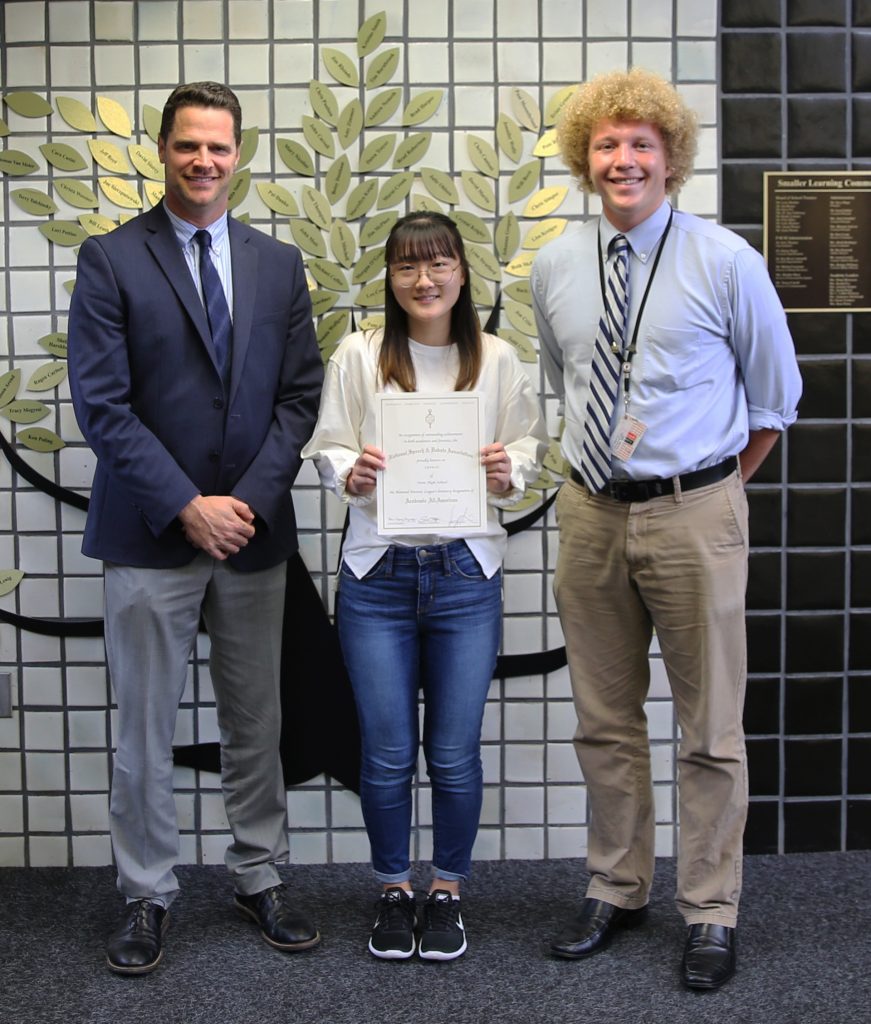 Penn Senior Lyvia Li (pictured above with Penn Principal Sean Galiher, left, and Penn Speech/Debate Coach Jeremy Starkweather, right), was named a National Forensic League Academic All-American.