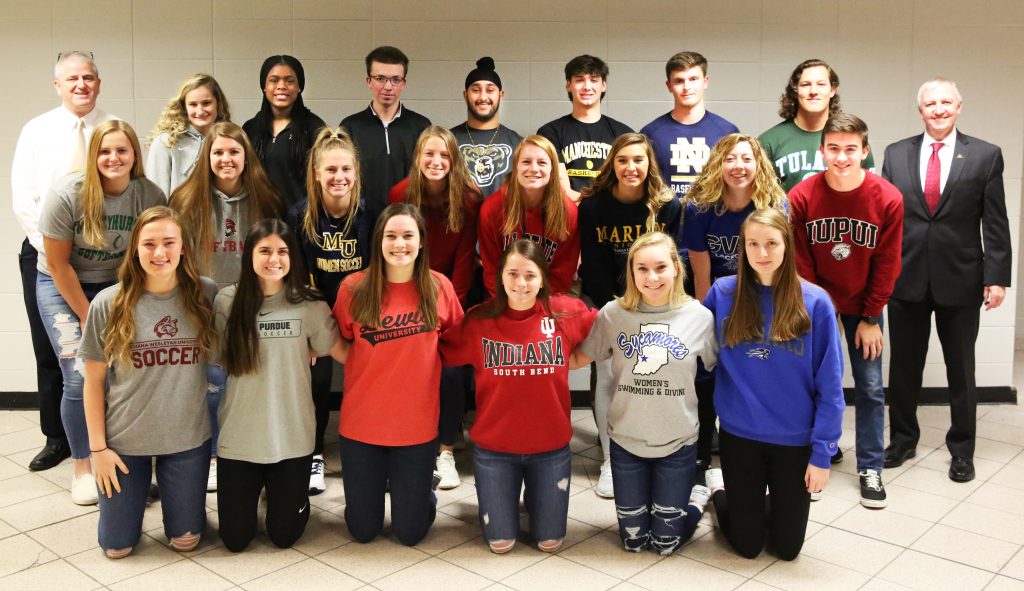 P-H-M Supt. Dr. Jerry Thacker, Penn High School Athletic Director Jeff Hart, and the 21 Kingsmen student-athletes who signed National Letters of Intent.