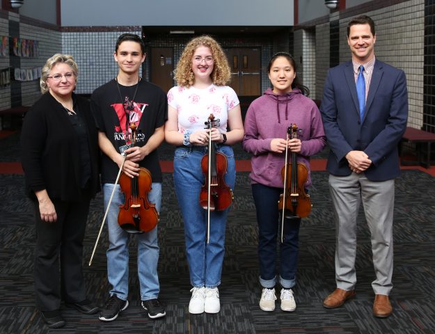 From left, Penn Orchestra Director Anne Tschetter, Joey Krachenfels, Maya Kvartskhelia, Erica Cheng and Penn High School Principal Sean Galiher. Krachenfels, Kvartskhelia and Cheng were named to the Indiana All-State Orchestra.