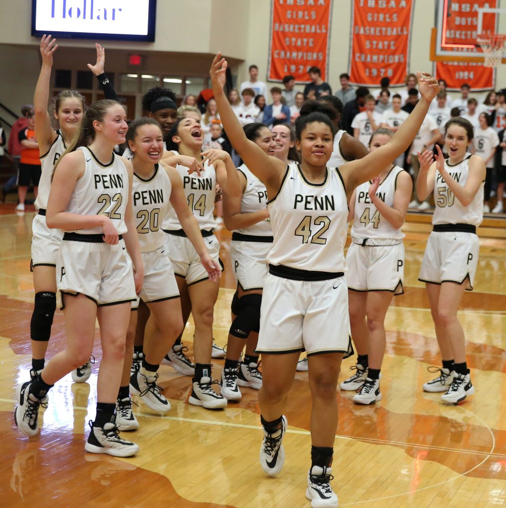 Trinity Clinton leads the cheers after the Penn Girls Basketball Team won the Sectional Championship.