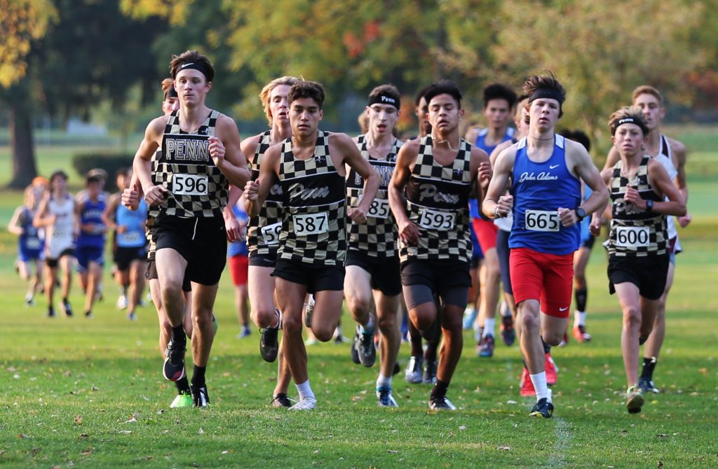 The Penn Boys Cross Country Team runs in a pack at the lead of the South Bend Sectional on Saturday, Oct. 10, 2020.