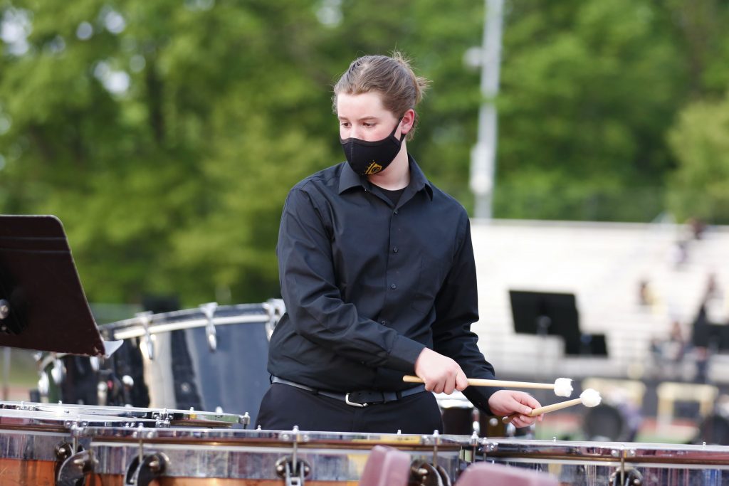 A percussionist for the Penn Band performs at Concert on the Track.