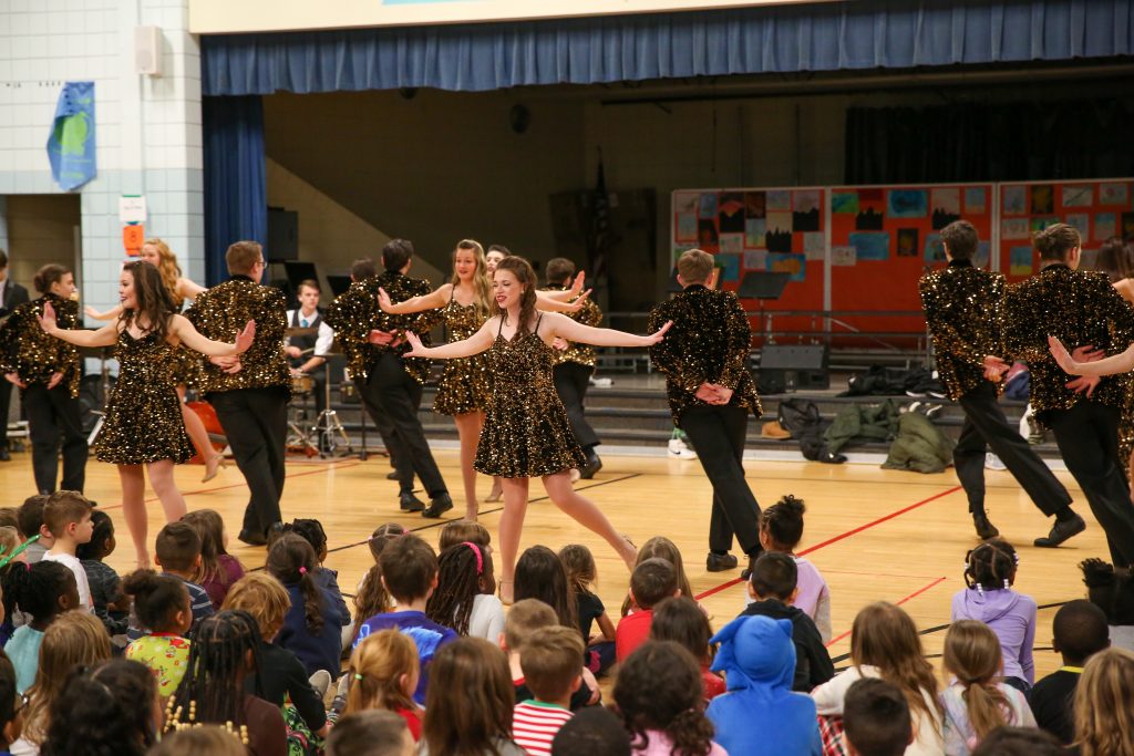 Penn Choir & Orchestra students perform for Walt Disney students