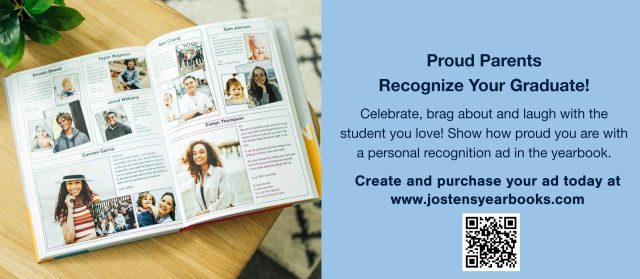 Graduation announcement card on a table with a book and a pen in the background.