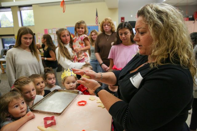 Students learn how to roll and cut sugar cookies