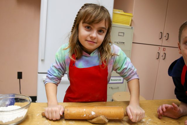 girl with rolling pin