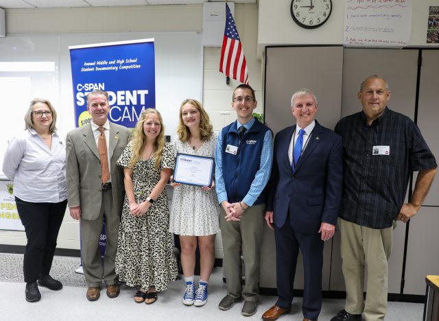CJ Vantine poses with parents, teacher, C-SPAN rep, Superintendent, and School Board President