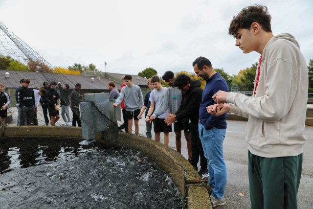 Students in Mr. Lopez's class feed Rainbow Trout at the Bodine State Fish Hatchery in Mishawaka, Ind.