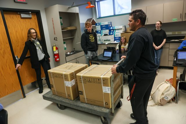 dishwasher boxes being delivered to biology classroom